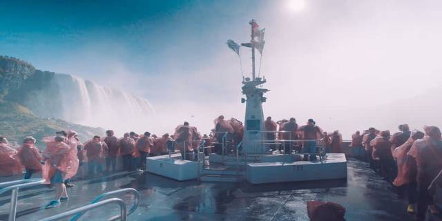 Tourists in red ponchos on Hornblower Niagara Cruise near the falls.jpg