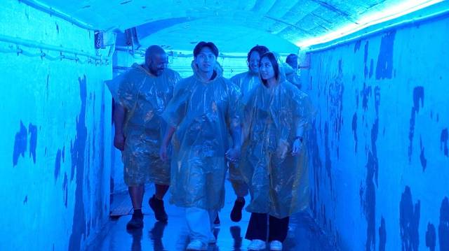 People in Journey Behind Falls tunnel tour.jpg