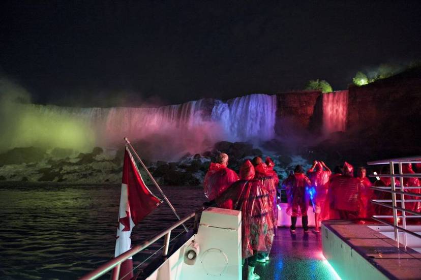 Visitors on a Niagara Falls fireworks boat cruise.