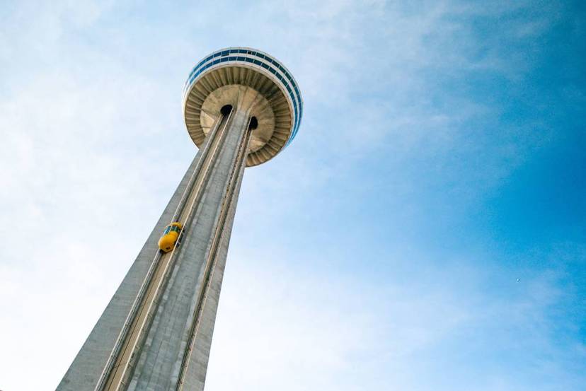 Skylon Tower with yellow exterior elevator ascending.