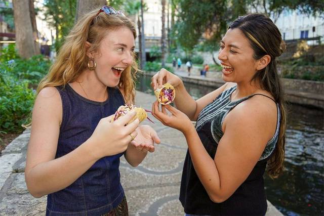 Friends Enjoying Tacos on Food Walking Tour