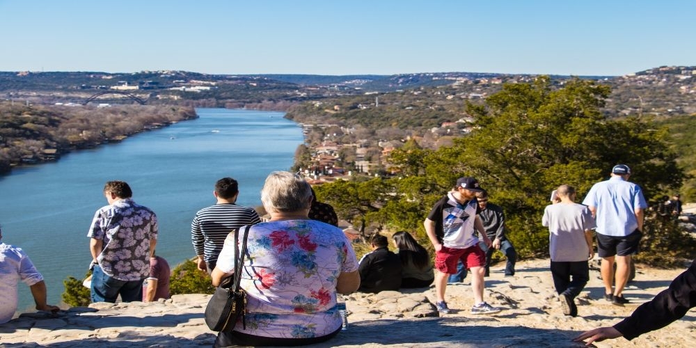 https://res.cloudinary.com/see-sight-tours/image/upload/v1674495850/strapi/1_Hero_Image_Guests_on_Mount_Bonnell_dad73b2093.jpg
